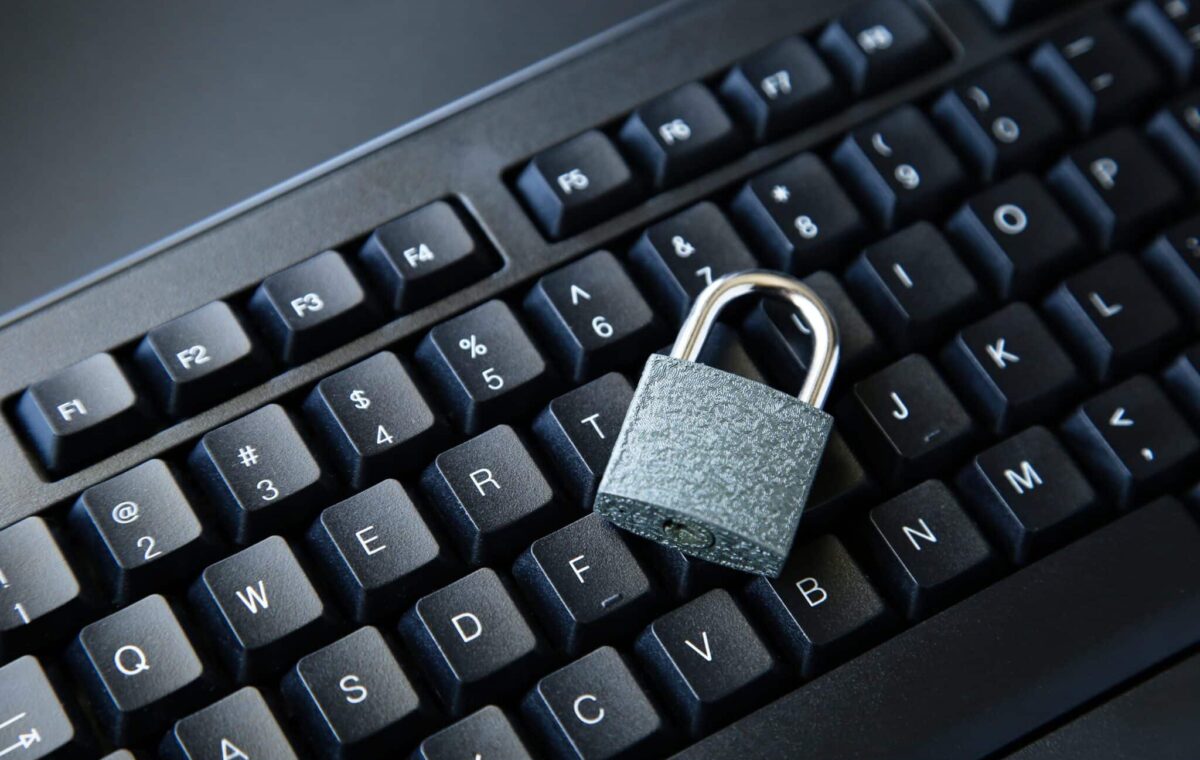 High angle shot lock black computer keyboard black surface