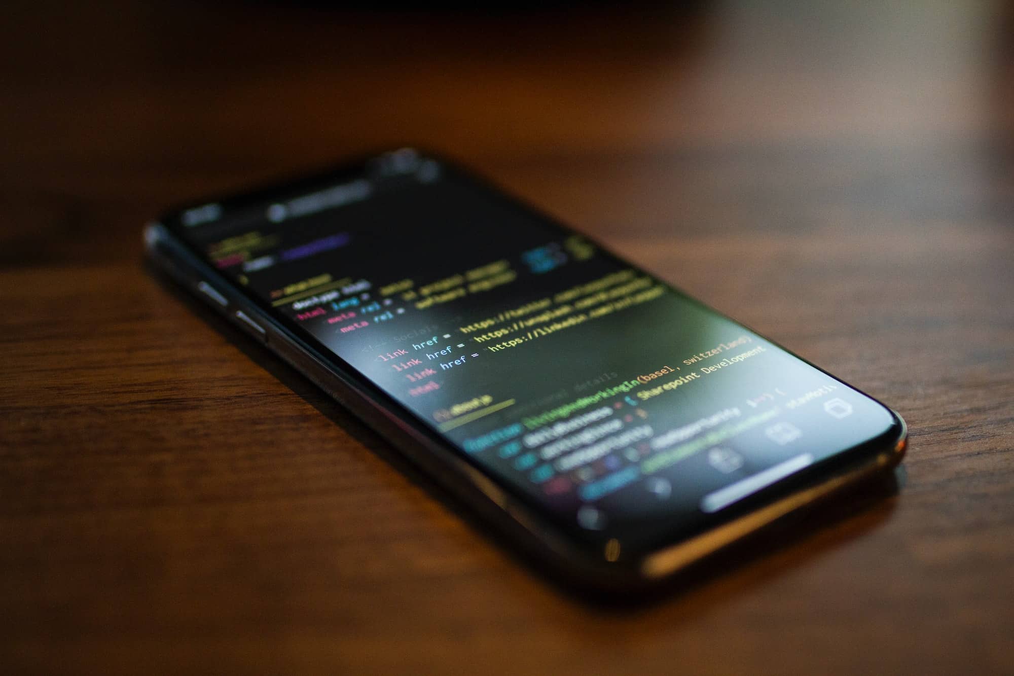 a picture of html code on a smartphone's screen
