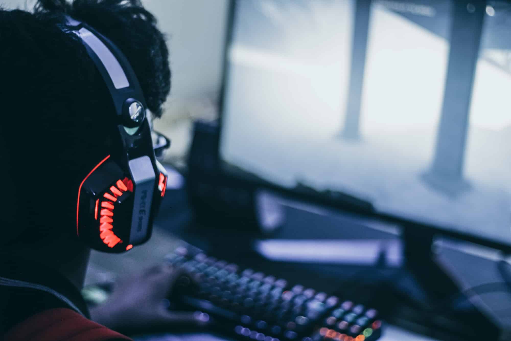 Person with headphones playing video game