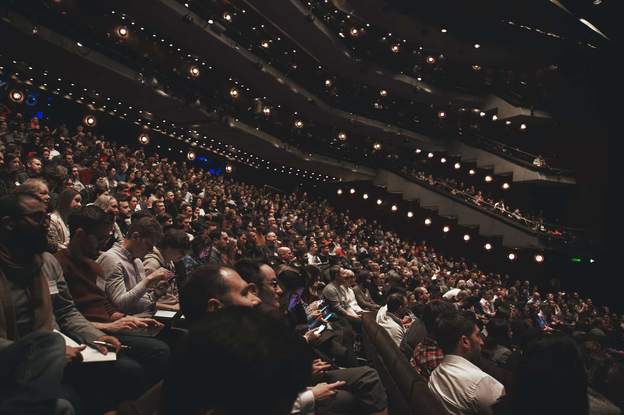 Audience in a large theater or auditorium